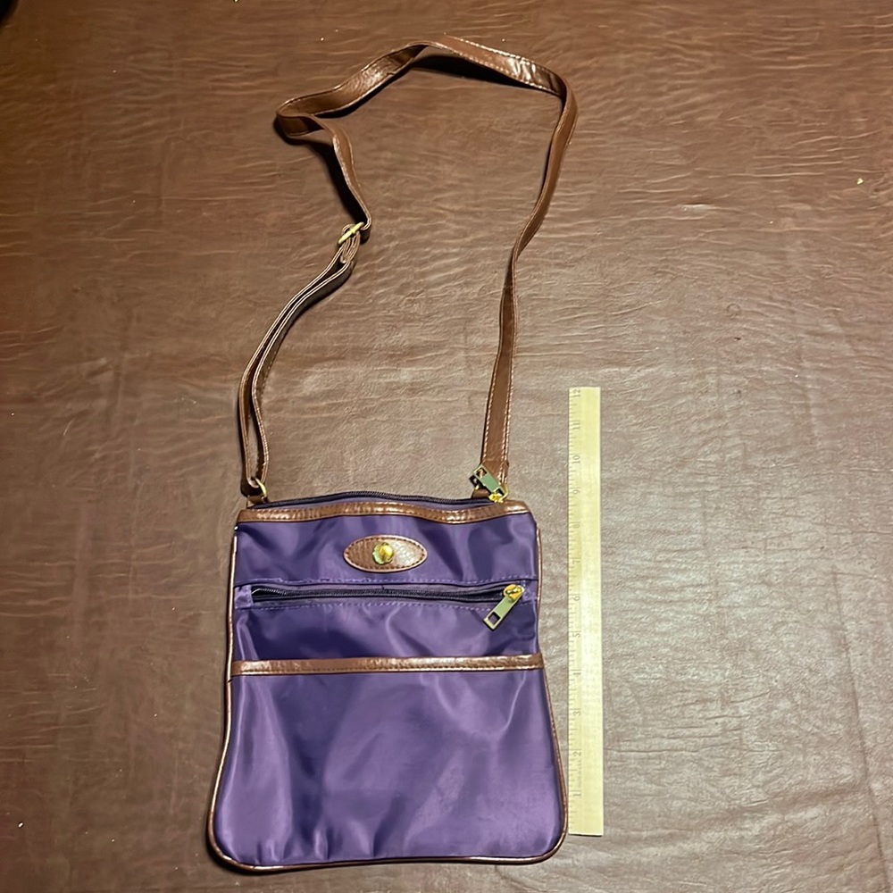 Free with purchase, purple cross body bag.